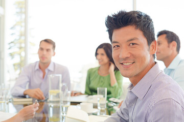 Businessmen smiling in office