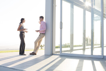 Business people talking outside office