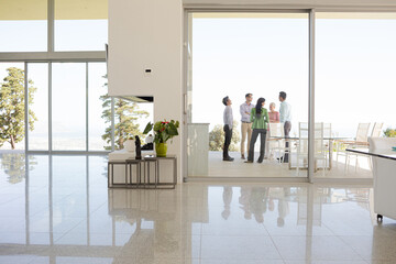 Business people talking outside office