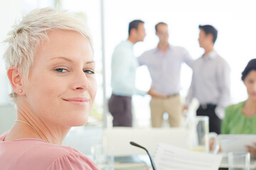 Obraz premium Businesswoman smiling in meeting