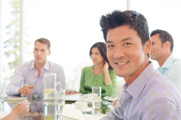 Businessmen smiling in office