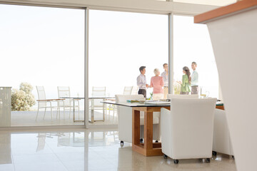 Business people talking outside office