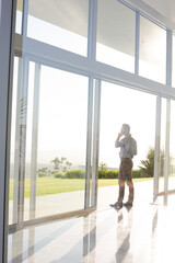 Businessman talking on cell phone outdoors