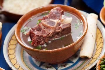 Beef broth, a traditional dish made from beef bone and vegetables.