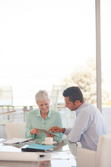 Obraz premium Business people using tablet computer on sofa