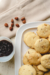 Homemade hazelnuts cookies in a plate - top view baked sweet food traditional recipe - healthy eating concept