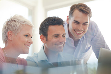 Fototapeta premium Business people using laptop in meeting