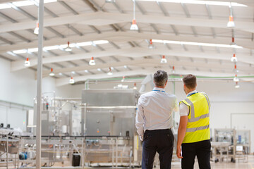 Supervisor and worker talking in warehouse