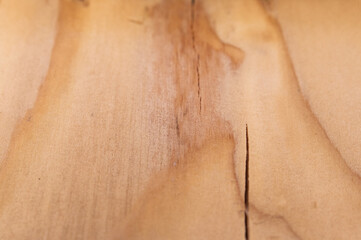 Fototapeta premium Close-up details of used, distressed, weathered pine pallet wood grain pattern with selective focus for copy space on a black background.