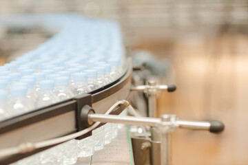 Bottles on conveyor belt in factory