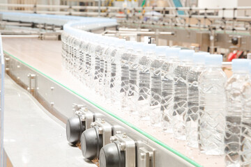 Bottles on conveyor belt in factory