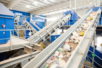Recycled material on conveyor belt in recycling center