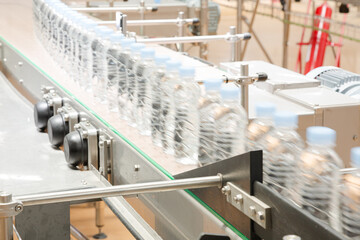 Bottles on conveyor belt in factory