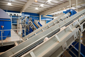 Obraz premium Recycled material on conveyor belt in recycling center