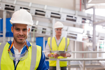 Workers smiling in recycling center