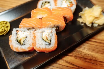 Philadelphia Maki Sushi made of Philadelphia Cream Cheese inside, Fresh Raw Salmon outside. Garnished with Sauce