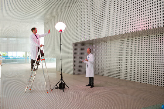 Scientists testing llamp in modern building