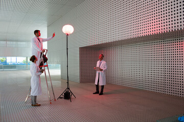 Obraz na płótnie Canvas Scientists testing llamp in modern building