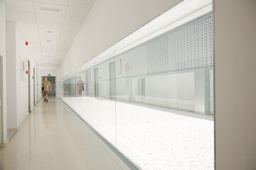 Man walking in corridor inside modern building