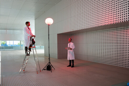 Scientists testing llamp in modern building