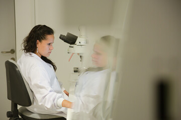 Fototapeta premium Doctor using microscope in laboratory