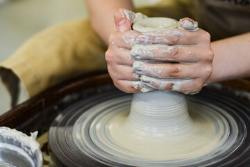 making pottery of different shape on pottery wheel