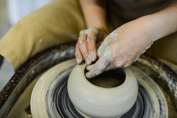 making pottery of different shape on pottery wheel