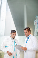 Scientists talking in laboratory