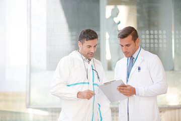 Scientists talking in laboratory