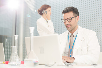 Doctor working at laptop