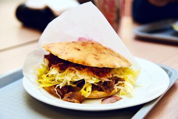 View of Doner kebab on a plate in a restaurant