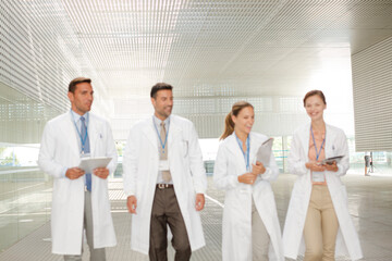 Doctors walking in hospital corridor