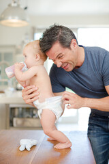 Father checking baby's diaper
