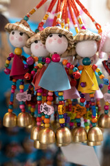 Small bells for sale. Little girl made of cloth.