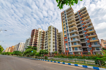 High rise residential apartment buildings with city road at Kolkata India - obrazy, fototapety, plakaty