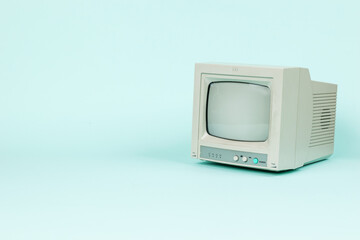 A small vintage monitor on a light background. Space for the text.