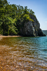 Naklejka premium Empty tropical landscape wild exotic island with mountain cliff and clear reflection sea water