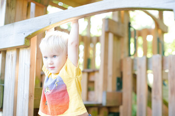 Boy playing on playset outdoors