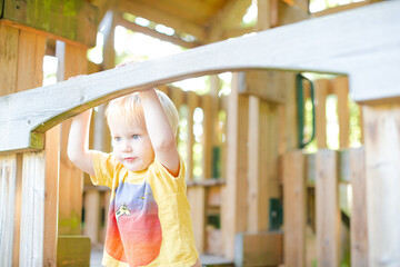 Obraz premium Boy playing on playset outdoors