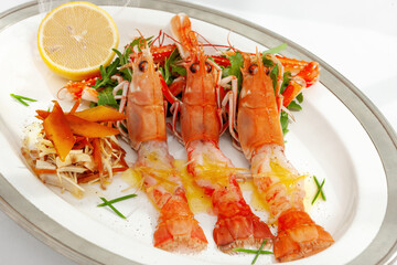 Grilled crudo langoustines with salad and lemon