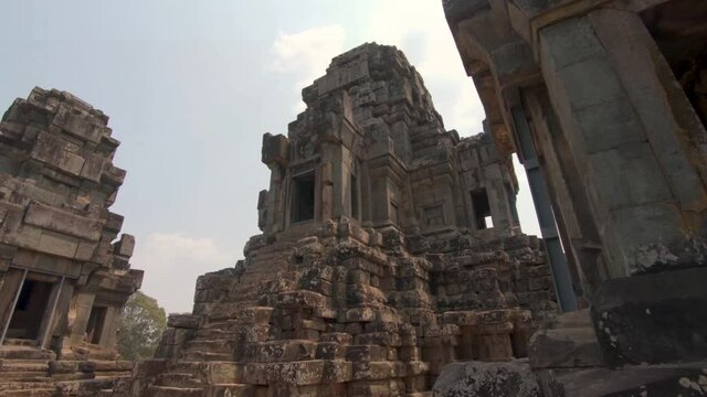 Ruins of Ta Keo temple and the sanctuary towers in Angkor Thom, Cambodia, cinematic point of view POV.