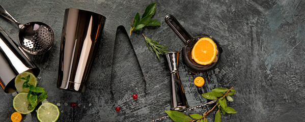 Cocktail bar equipment on dark background.