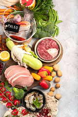 Paleo diet food on light gray background.