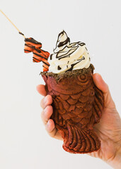 Japanese sweet dessert. Ice Cream Taiyaki. Freshly baked fish shape waffle instead of filling red beans, sweet potato or sweet corn, adding ice cream is perfect combination, ideal during summer.