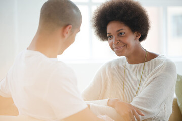 Couple talking indoors