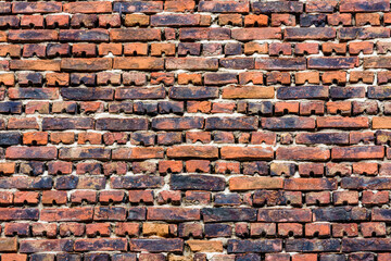 Old wall made of red bricks for the background