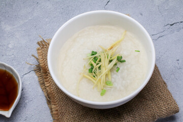 Rice porridge or Congee with fresh ginger and coriander, is a favorite breakfast for south east asian people.