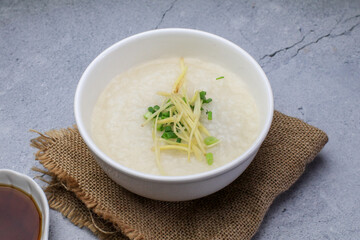 Rice porridge or Congee with fresh ginger and coriander, is a favorite breakfast for south east asian people.