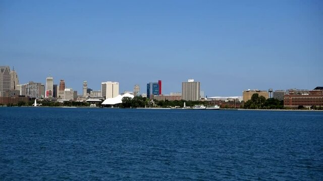 Panoramic view of Detroit downtown for the opposite river bank by a sunny day