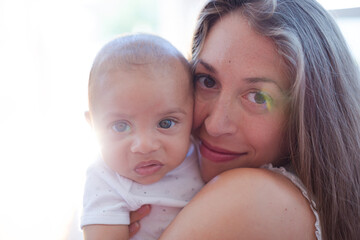 Mother holding baby boy